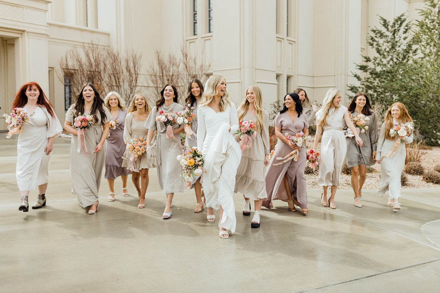 bridal party carrying bouquets of flowers at a Utah wedding