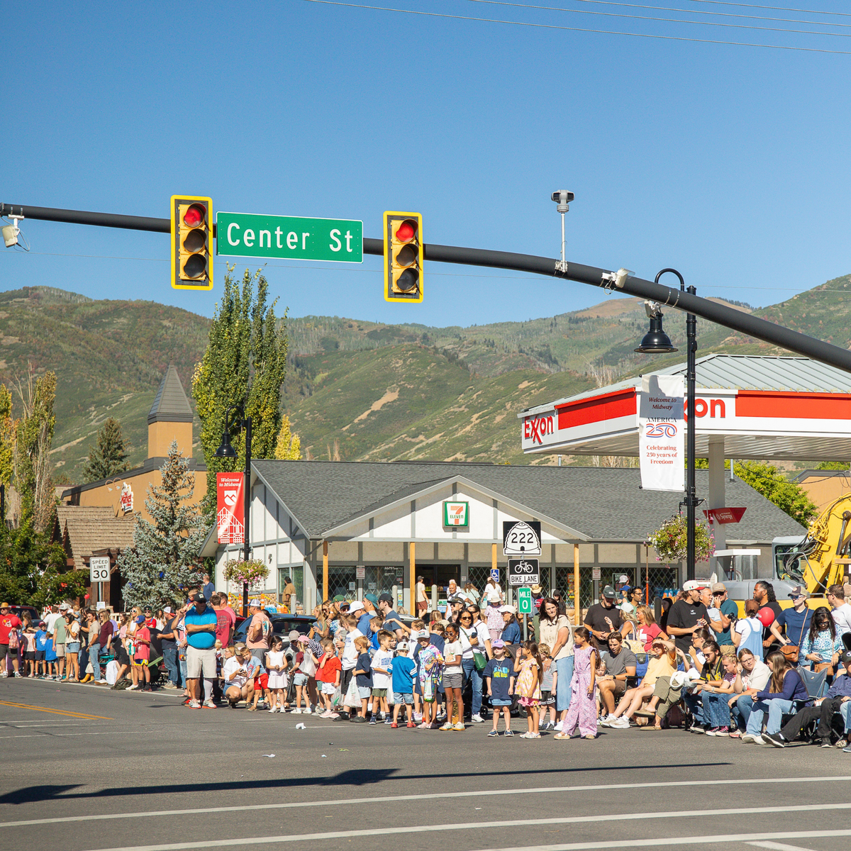 Midway Swiss Days Parade crowd on Center Street in Utah.