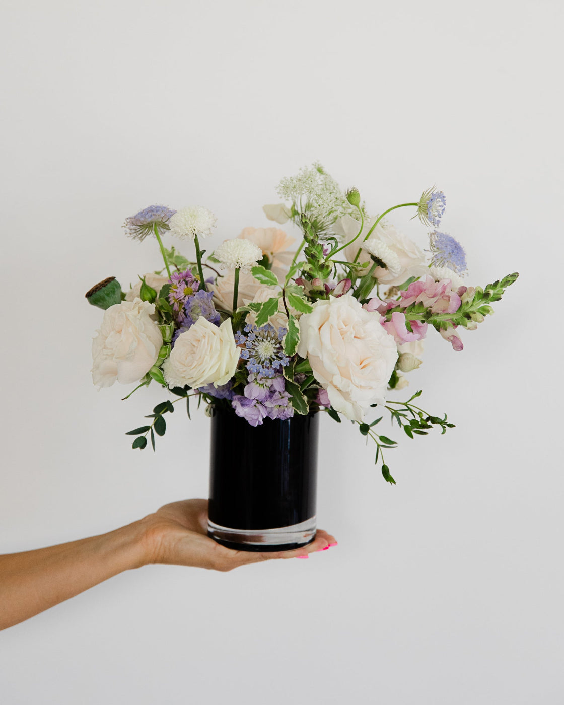 petite flower arrangement in black vase