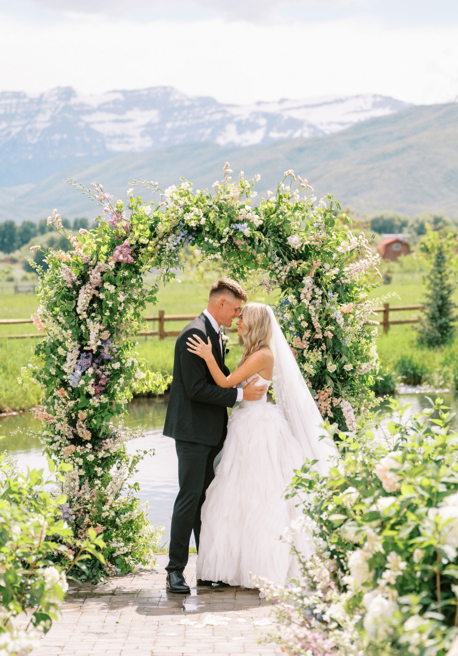 wedding arch and aisle markers by Flower bar co in Utah